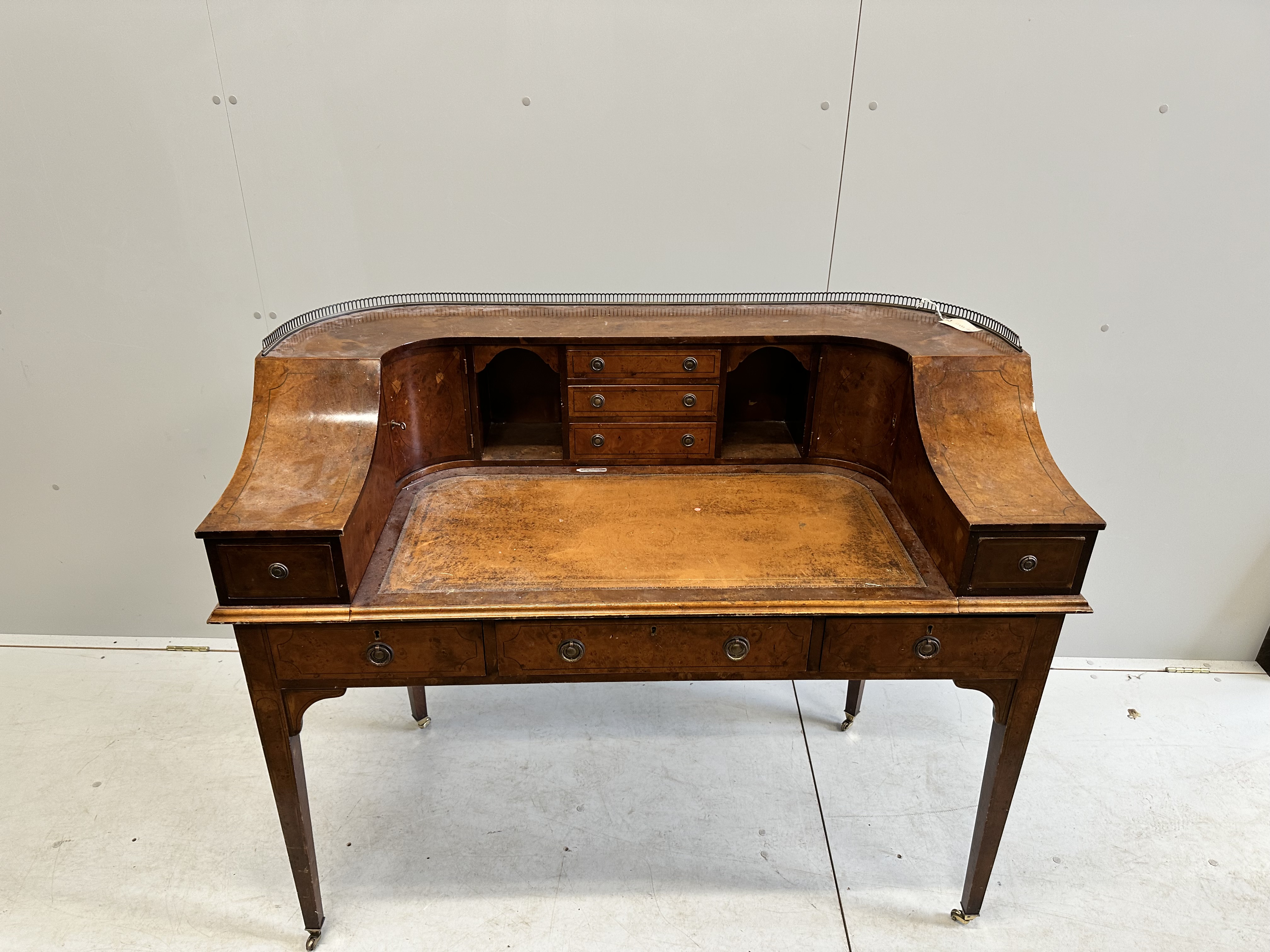 A reproduction yew Carlton House desk, width 123cm, depth 62cm, height 102cm